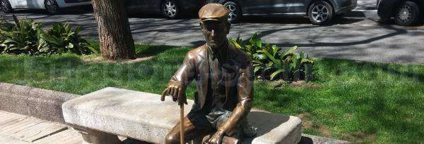 Old man sitting sculpture